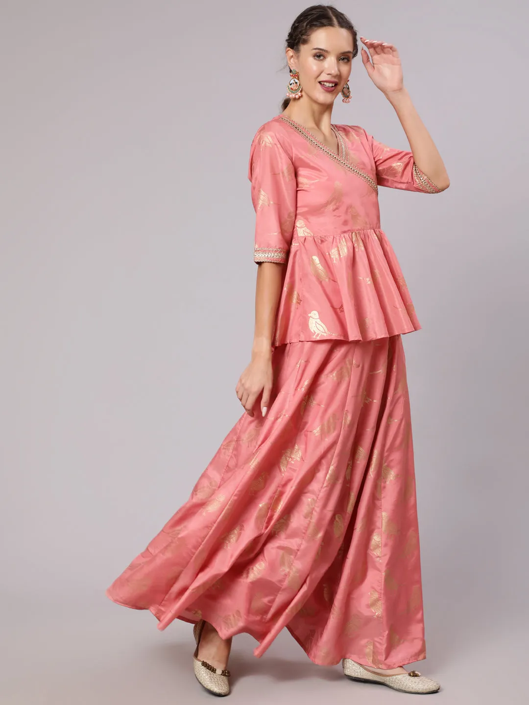 A Peach Color Bird Printed Silk Blend Peplum Top And Skirt With A Gold Print Net Dupatta